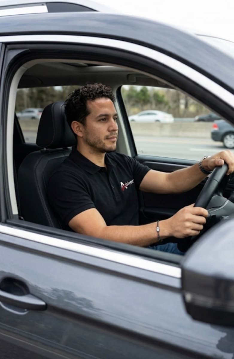 A certified Adriver driver behind the wheel